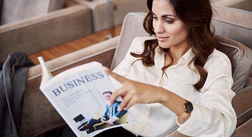 Business woman reading business publication