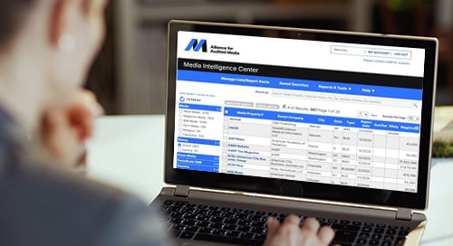 Woman looking at Media Intelligence Center on her computer.